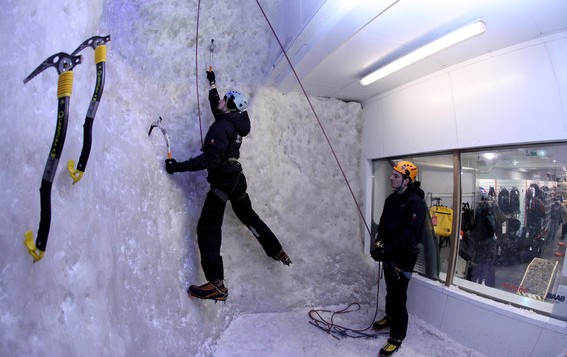 1 man climbing the ice wall at Ellis Brigham